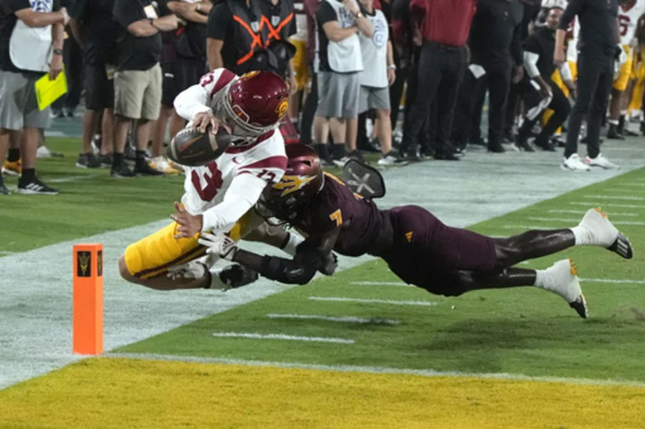 Williams accounts for 5 touchdowns, No. 5 USC outlasts Arizona State 42-28