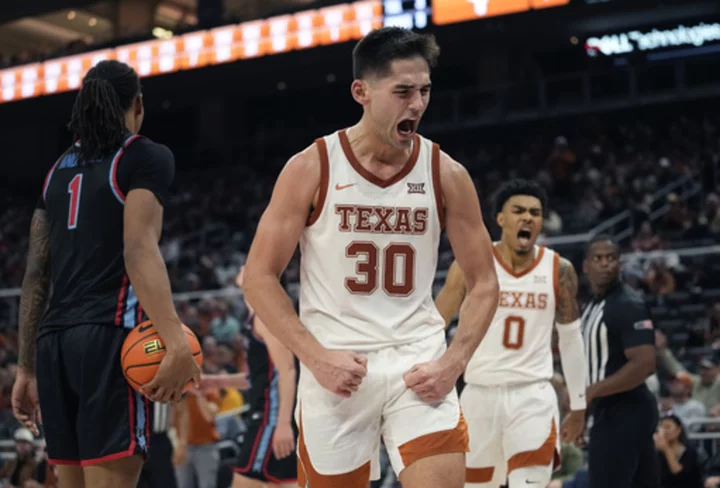 No. 18 Texas uses 3-pointers to pull away and beat Delaware State 86-59