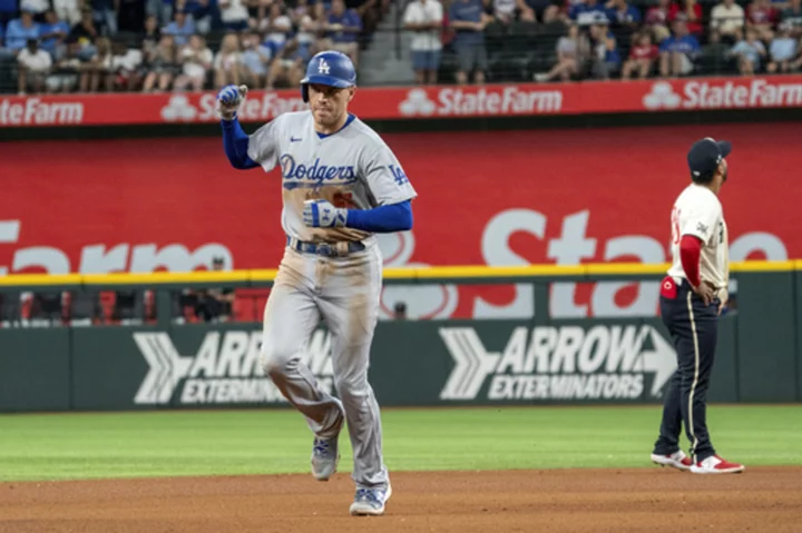 Freeman hits 2 of the Dodgers' 5 HRs as they rout the Rangers 16-3 in matchup of division leaders