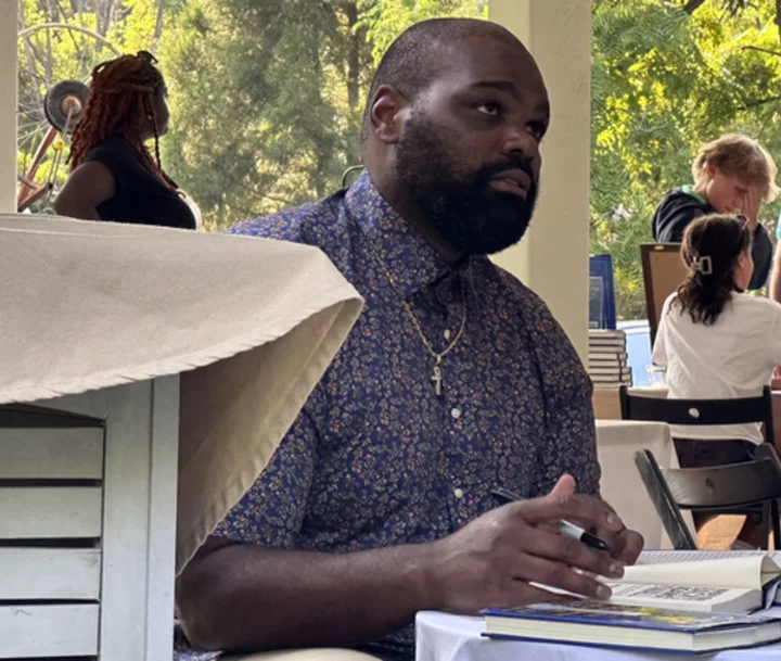 Michael Oher greets fans at a Baltimore book signing a week after suing to end his conservatorship