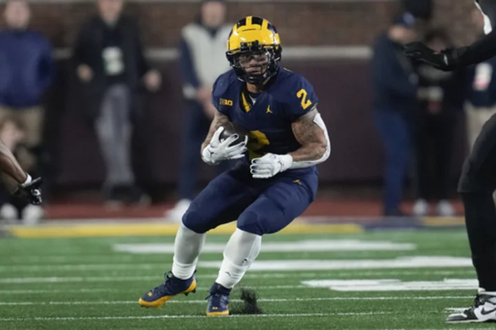 Michigan star Corum says he had no business with Stalions, unaware of online records in his name