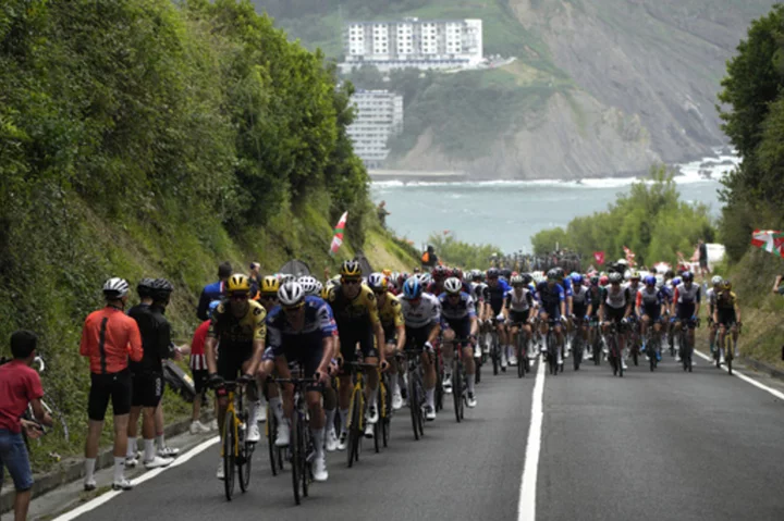 Adam Yates beats twin brother Simon Yates to win initial stage of Tour de France