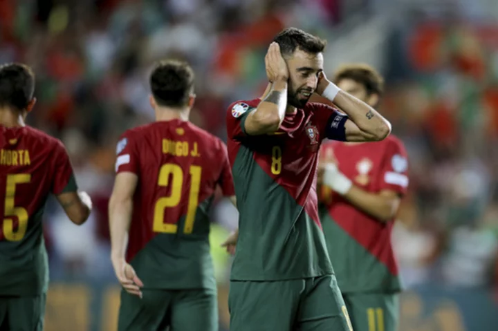 Portugal routs Luxembourg in record 9-0 win without suspended Ronaldo. Drone delays Armenia-Croatia