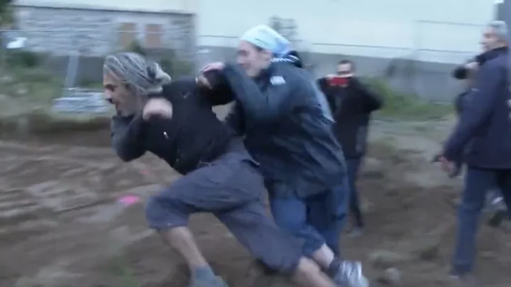 Nun Tackles Environmental Activist Into Dirt Pit