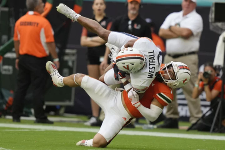 Fletcher gets 11-yard TD run in OT; Miami holds off Virginia 29-26