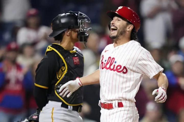 Bryce Harper homers in the 7th inning and leads the playoff-bound Phillies past the Pirates 7-6