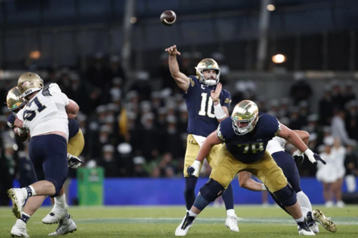 Hartman throws 4 TD passes as No. 13 Notre Dame opens with a 42-3 win over Navy in Ireland