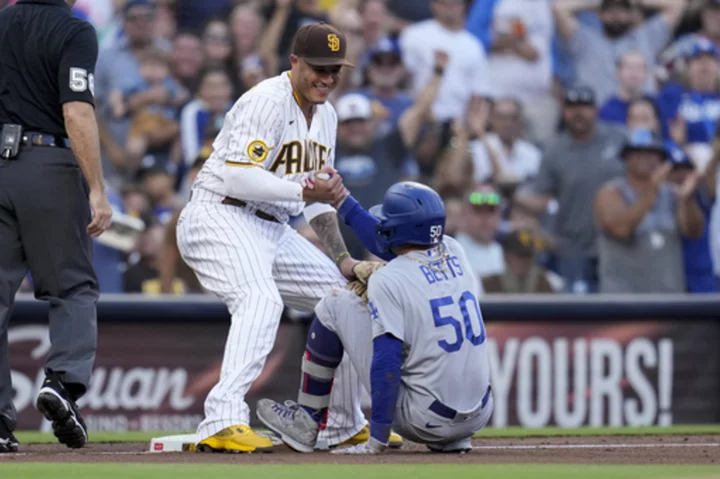 Machado hits a home run and a 2-run, go-ahead single to lift the Padres over the Dodgers 8-3