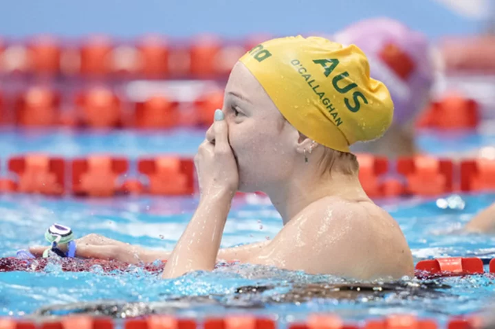 Mollie O’Callaghan sets a world record at the swimming world championships and wins the gold medal