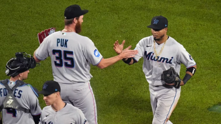 Garrett and Segura lead the Marlins past the Red Sox, 6-2