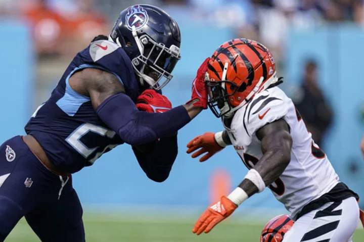 Henry runs for TD, throws for score as Titans rout Burrow, Bengals 27-3