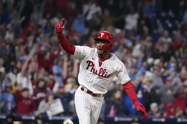 Rojas hits RBI single in 10th, sending Phillies past Pirates 3-2 and clinching wild-card berth