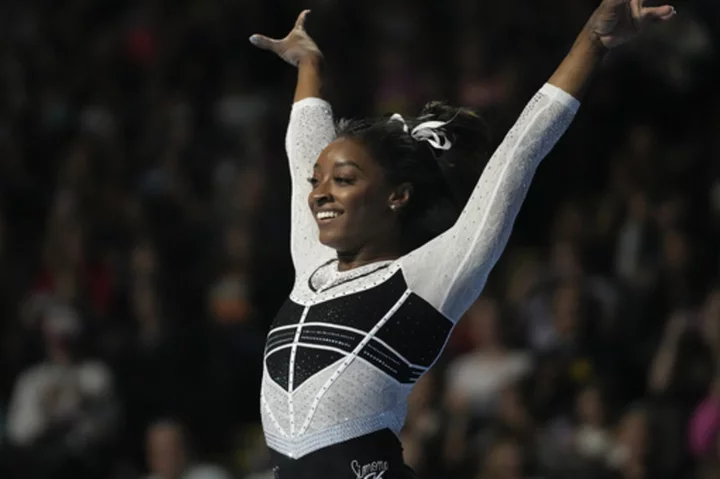 Simone Biles dazzles in her return following a two-year layoff to easily claim the U.S. Classic.