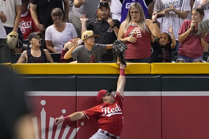 Pham loses homer on bizarre fan interference, Diamondbacks beat Reds 10-8