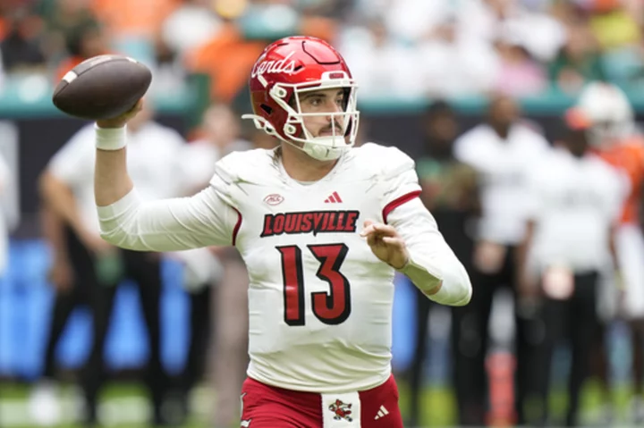 No. 9 Louisville tops Miami 38-31, clinches spot in ACC championship game