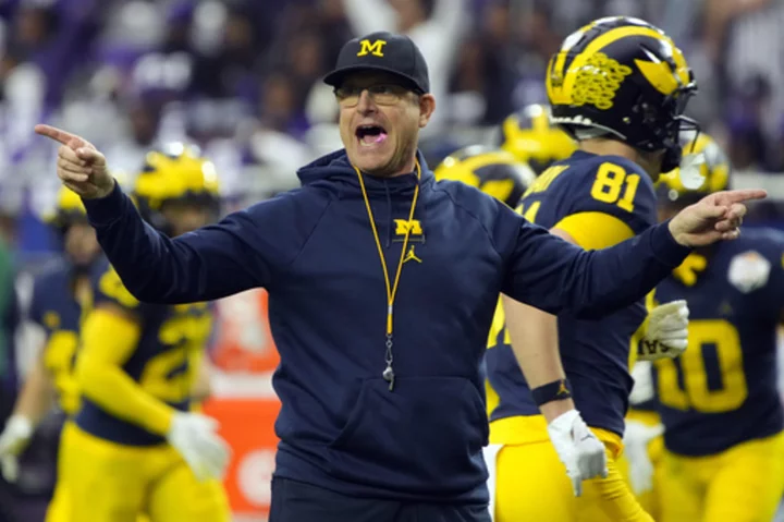 Michigan coach Jim Harbaugh facing 4-game suspension for breaking NCAA rules, AP source says