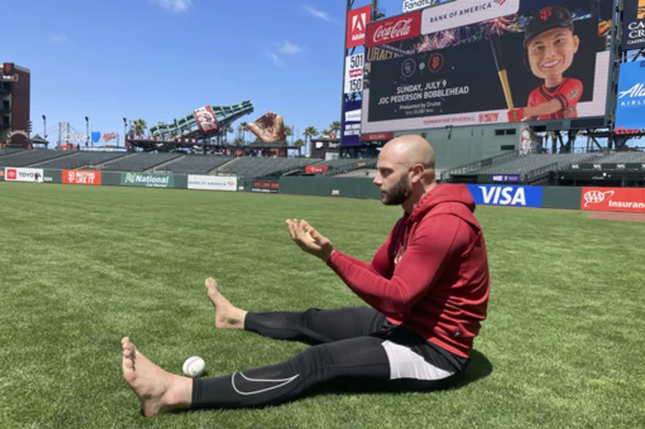 Baseball players are staying mindful on the diamond with barefoot walks in the grass