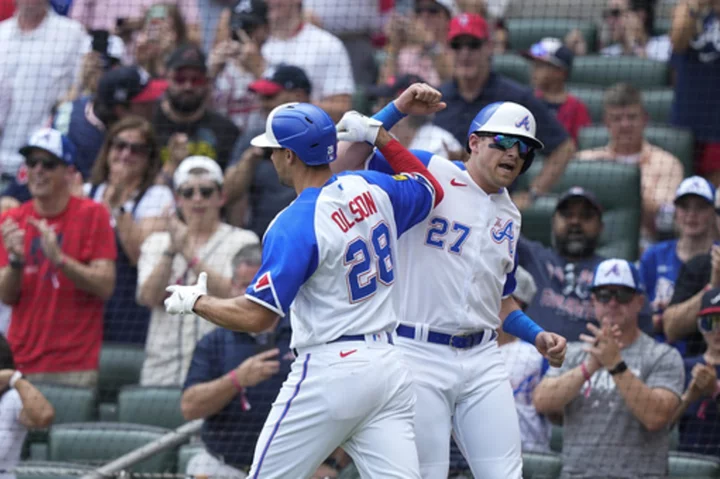 Olson hits early grand slam, NL-leading Braves add three more homers for 5th straight victory