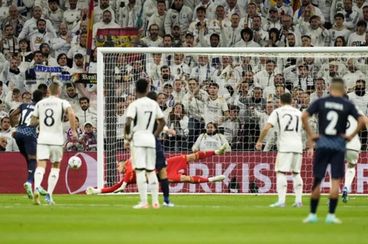 Lunin saves penalty after Kepa injury. Real Madrid eases into knockout stage of Champions League