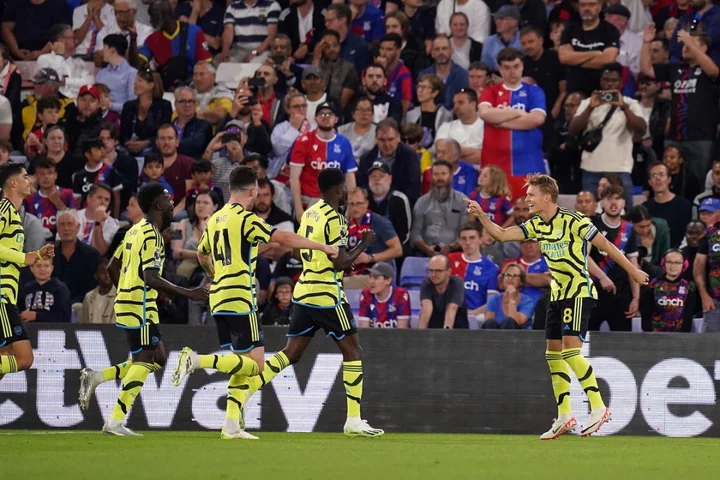 Martin Odegaard’s penalty earns 10-man Arsenal gritty victory at Crystal Palace