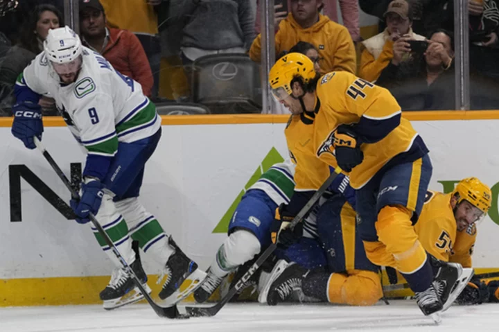 Di Giuseppe and Hoglander's second period goals lead Canucks to 3-2 defeat of the Predators