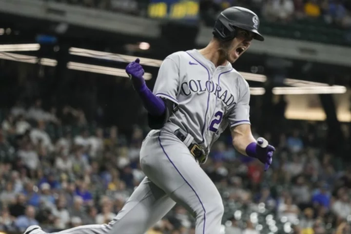 Rockies get three bases-loaded walks in 10th inning, beat NL Central-leading Brewers 7-3