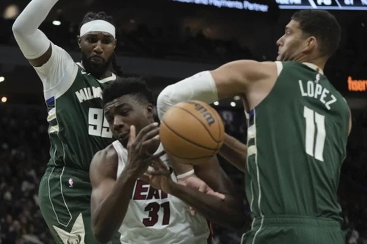 Antetokounmpo, Lillard help Bucks build big lead, hold off Heat in playoff rematch