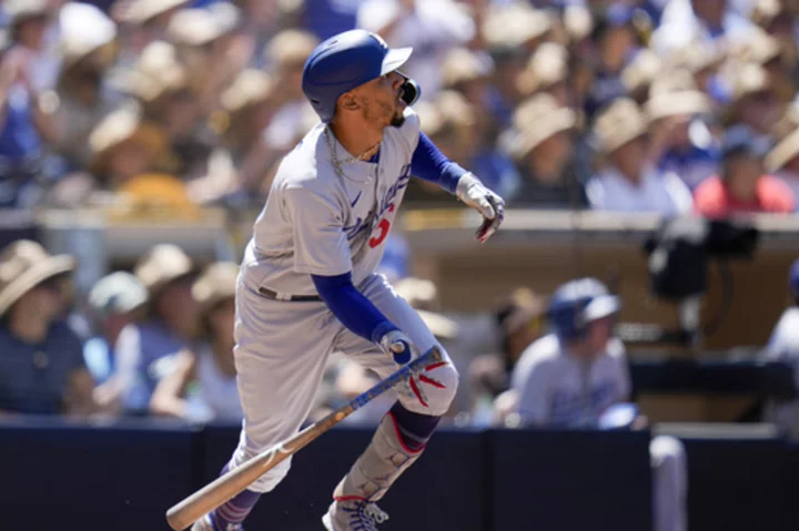 Betts' grand slam caps 8-run 4th inning as the Dodgers stun the Padres 13-7