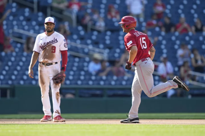 Senzel saves run in 9th, homers leading off 10th and Reds beat Nationals 5-4 for sweep