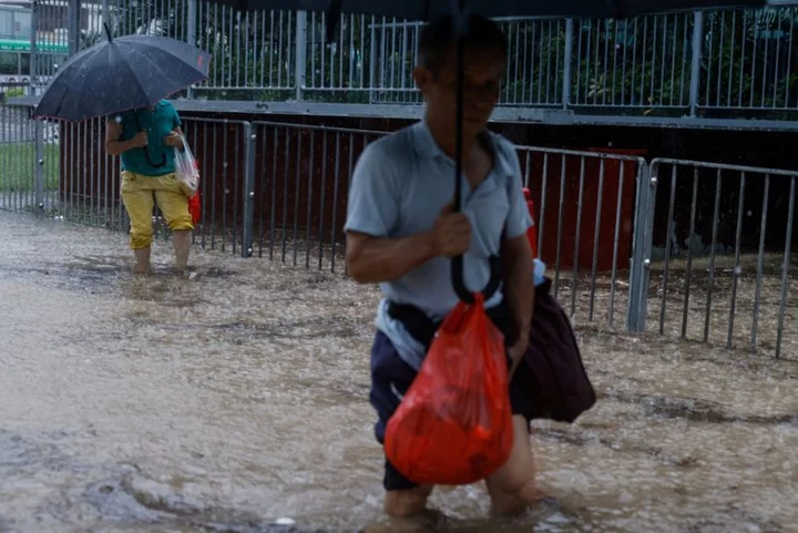 Hong Kong's heaviest rain in at least 140 years floods city streets, metro