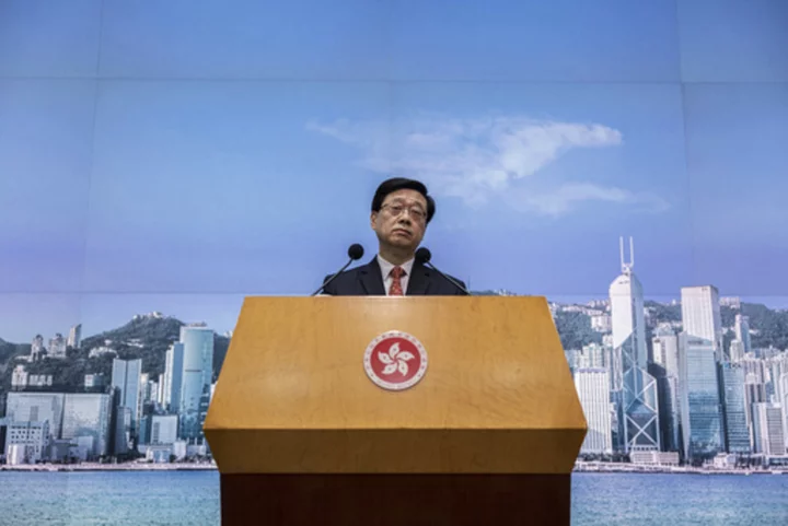 Hong Kong leader says 8 pro-democracy activists who now live in the West 'will be pursued for life'