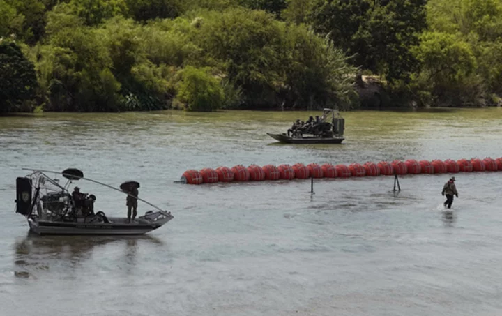 Mexico recovers 2 bodies from the Rio Grande, one found near a floating barrier that Texas installed