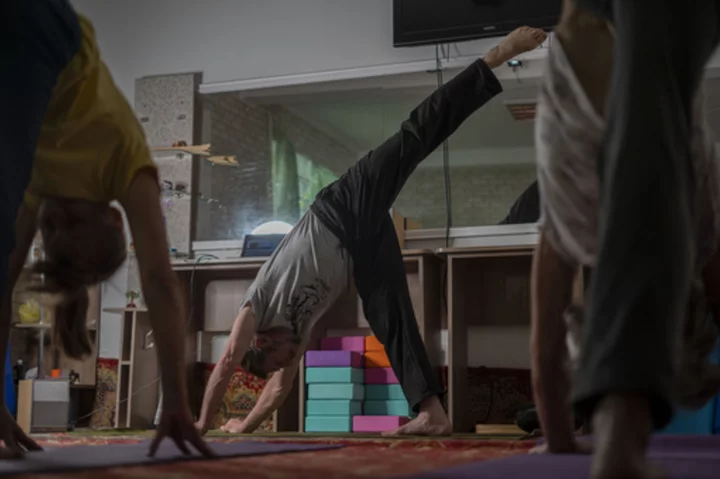 Yoga in a basement helps people in a Ukrainian front-line city cope with Russia's constant shelling