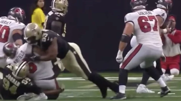 Baker Mayfield Throws Touchdown Pass While Taking Brutal, Dirty High and Low Hit From Saints Defenders