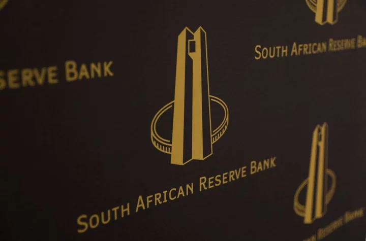 South Africa's central bank holds rates as economy improves