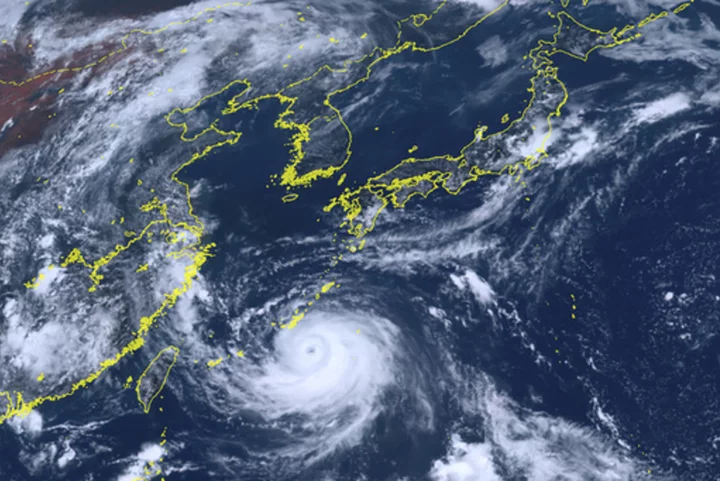 Powerful Typhoon Khanun lashes southwest Japanese islands, grounding flights and closing businesses