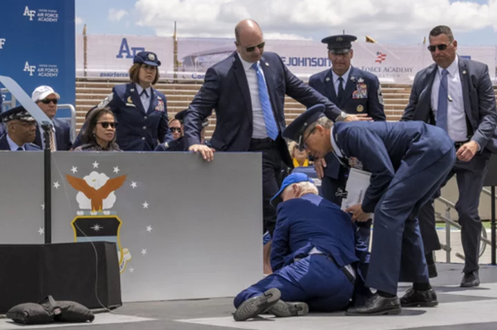 Biden trips and falls on stage at Air Force graduation; White House says he's 'fine'