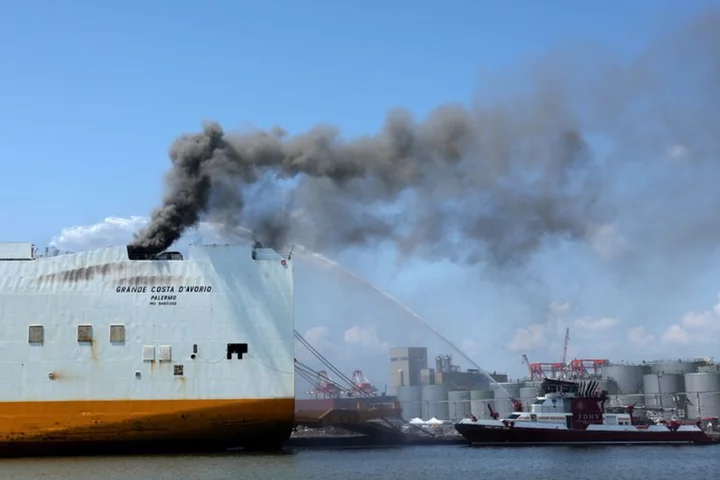 Blaze aboard ship docked at New Jersey port kills two firefighters
