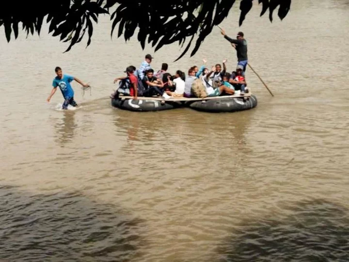 Families board makeshift rafts to get closer to the US